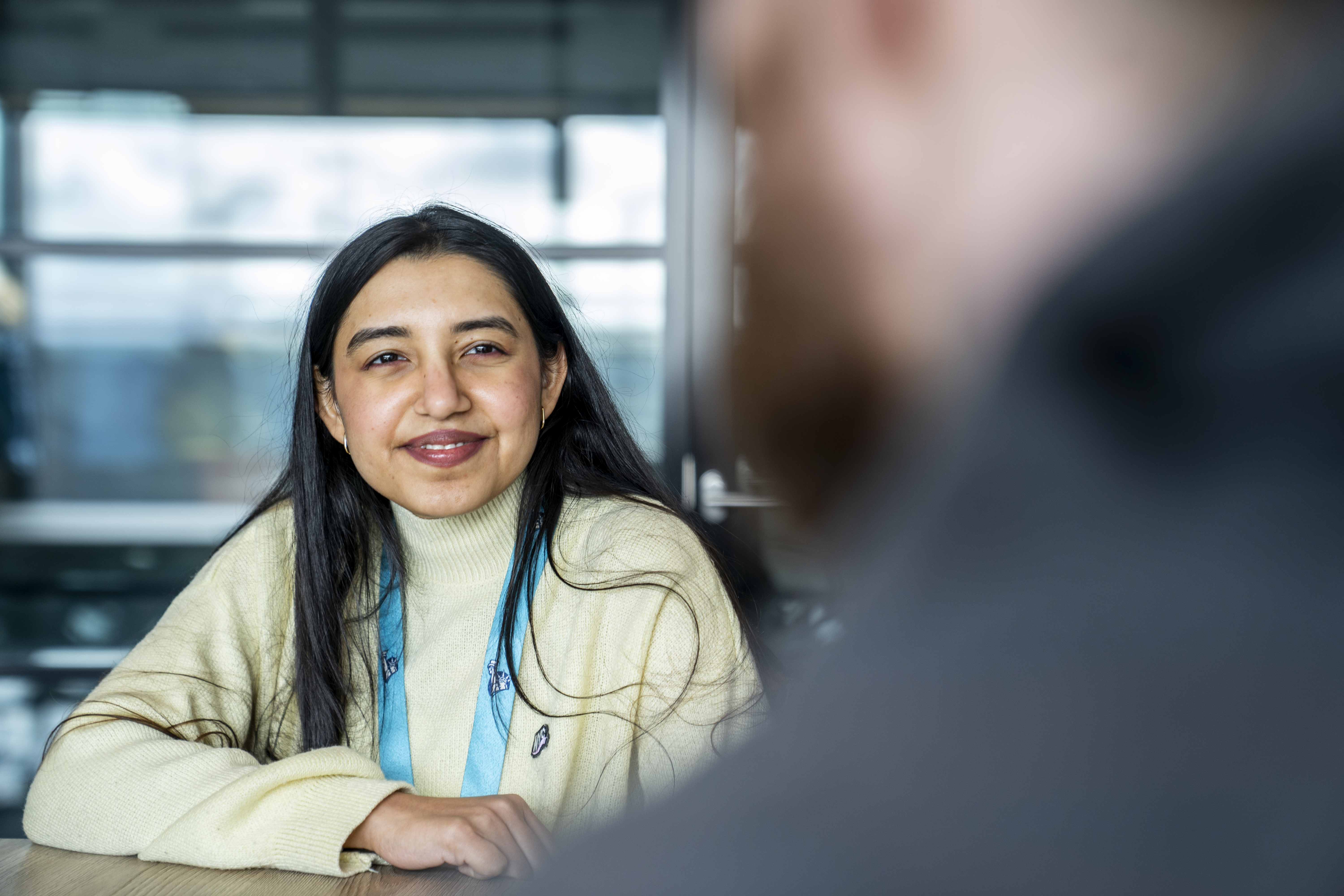 Liberty IT employee smiling in a meeting