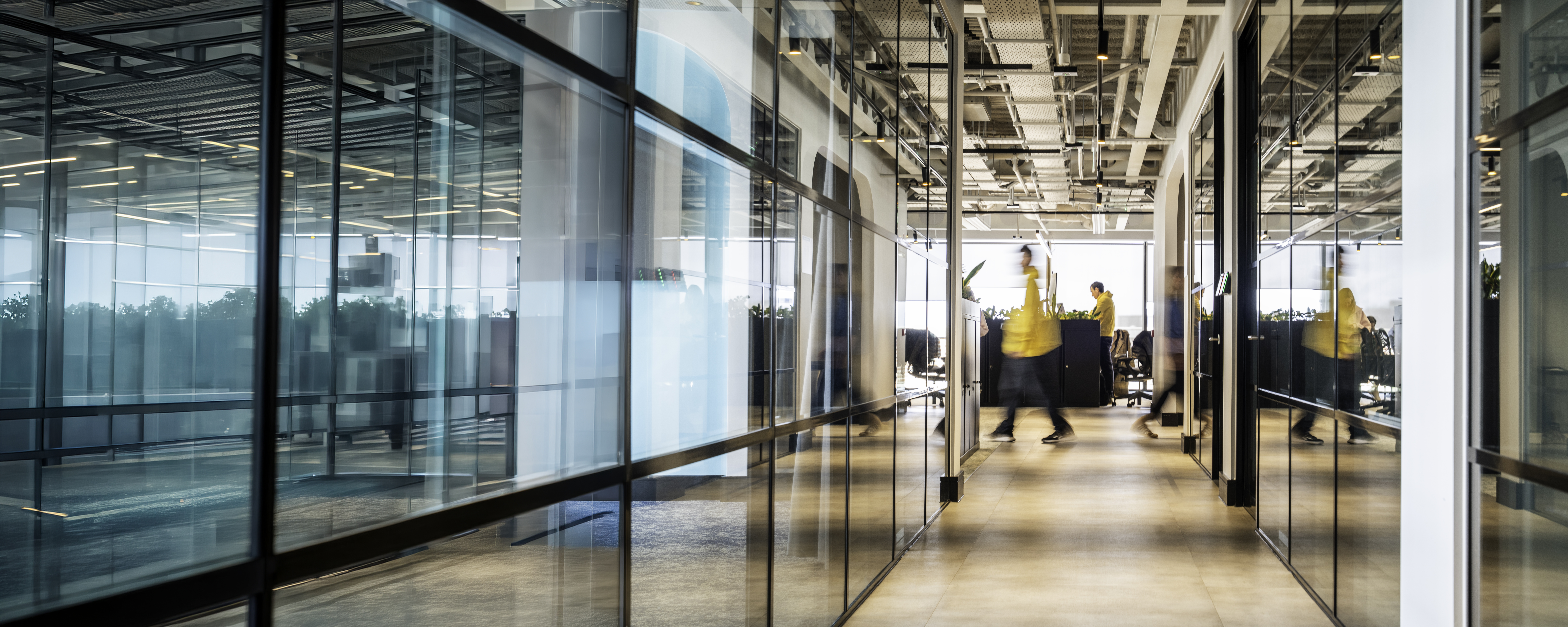 Employee walking with a blurred motion in office building