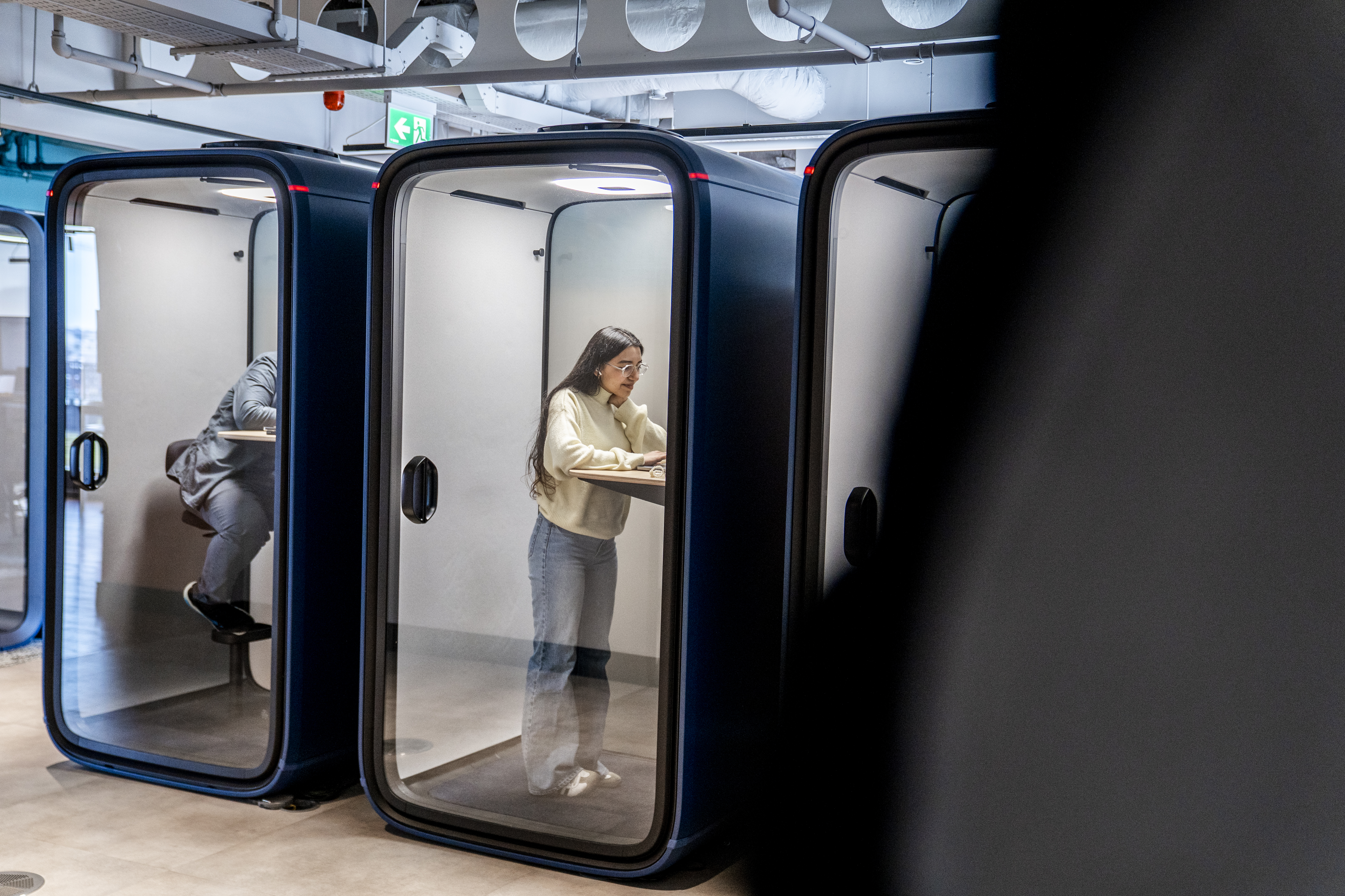 Person working in a meeting pod