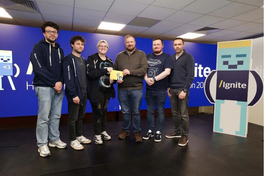 Liberty IT finale team at finals being presented their award