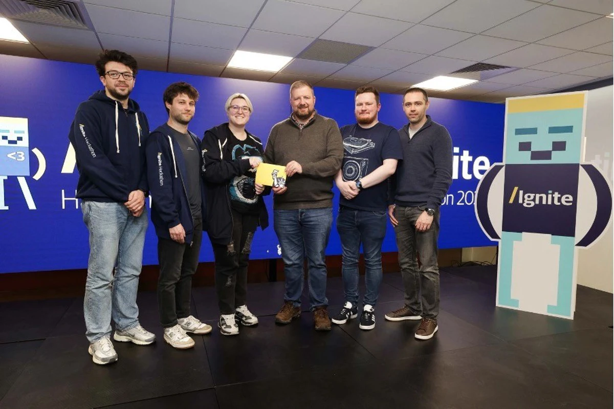 Liberty IT finale team at finals being presented their award