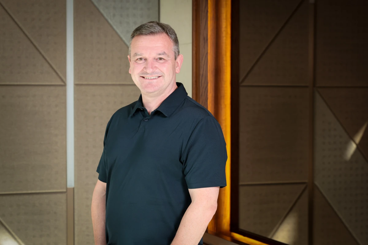 Tony Marron smiling in an office environment 