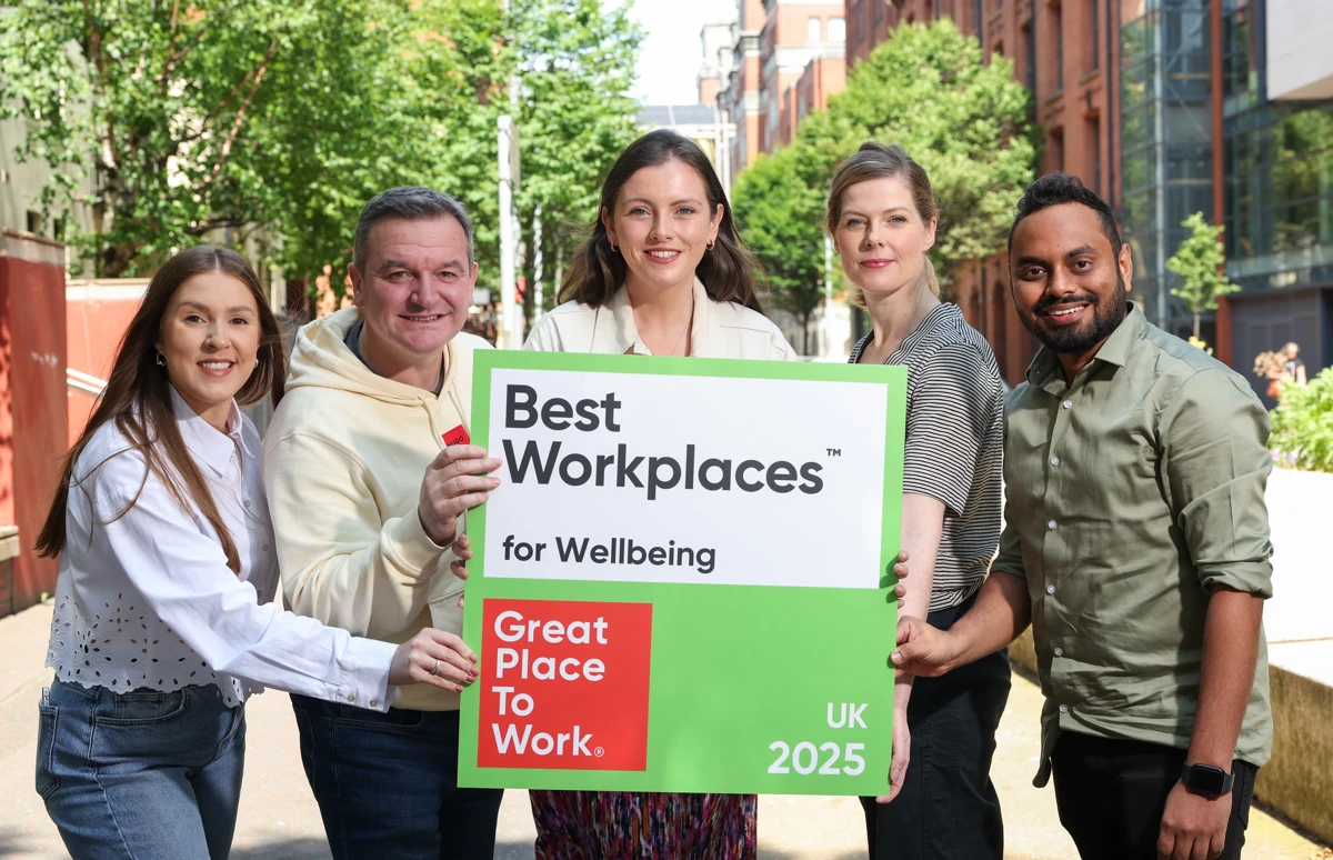 Five employees smiling with GPTW certification